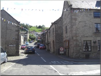 Winster village street leading up towards the Limestone Way
