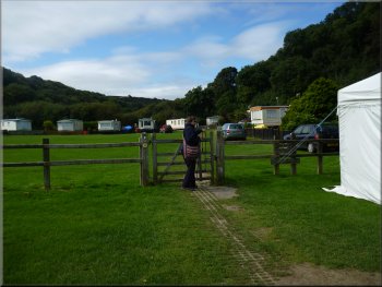 Path through a caravan site leaving Cwm-yr-Eglwys