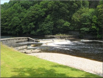 Ornamental weir on the edge of Low Mill Village