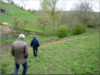 Heading down the hillside across a farm track at the bottom