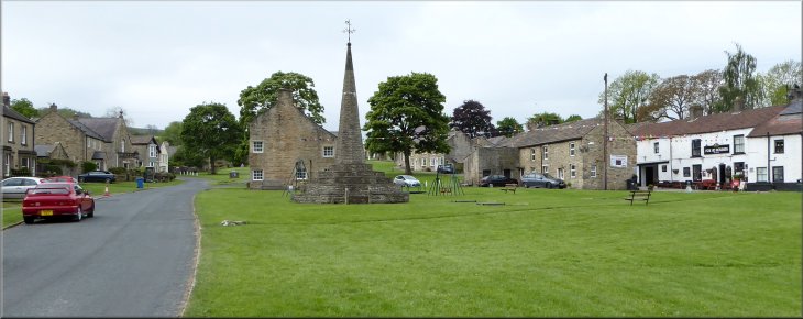 The market cross on the village green at West Burton