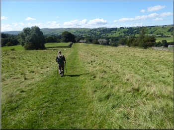 Path across the field to the old stone barn