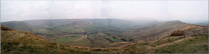 Looking down Edale from Brown Knoll 
    with the rocky outline of Kinder Scout to the left and the peaks of the Mam 
    Tor ridge to the right