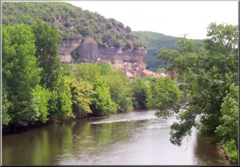 L'Eyzise on the river Vezere with houses built into the cliff face