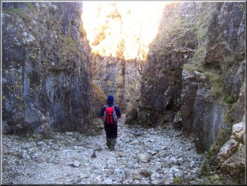 Negotiating a narrow section of Conistone Dib near the village