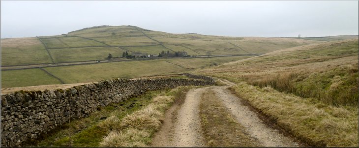 Looking back along the Black Hill Road to the B6265 and Nursery Knott hill beyond