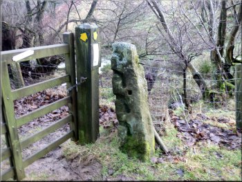 Old stone gatepost with slots for the crossbars