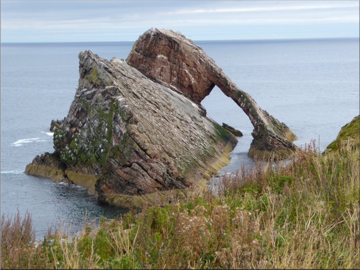 The Bow Fiddle Rock seen from the cliff top path