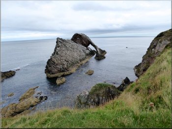 The Bow Fiddle Rock seen from the cliff top path