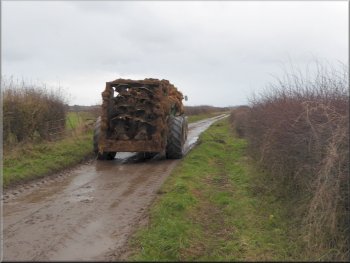We kept close to the hedge as this muck spreader passed by