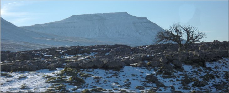 The distinctive shape of Inglebrough seen across Fell Close Rocks