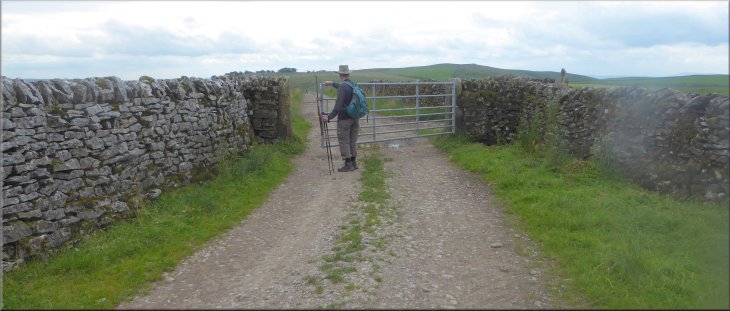 Gate from the sheep pasture to a walled track