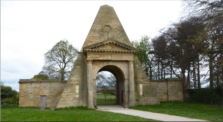 The Obelisk incorporating a gateway at the edge of the parkland