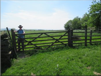 Turning left through the gate at the top of the field near the farm