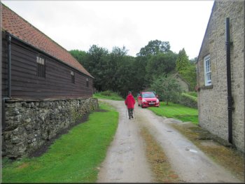 Following the bridleway between the buildings