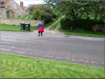 Turning right to a public footpath up a gravel drive