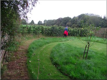 Diverted path round the perimeter of the garden