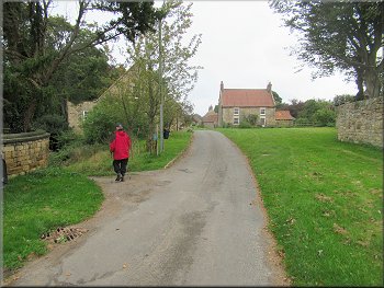 Turning left off the lane to a bridleway on an access track