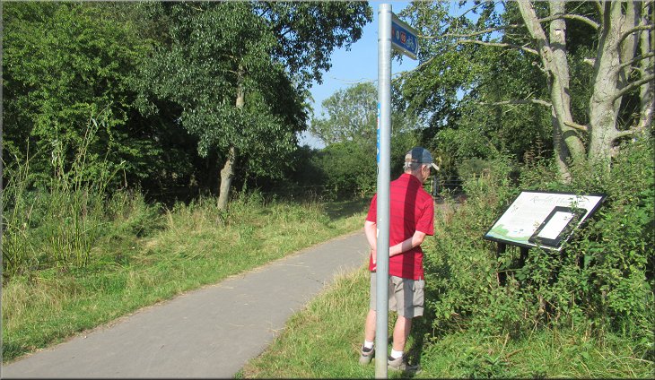 Jim, reading the information board at the junction with the path along Rawcliffe Ings