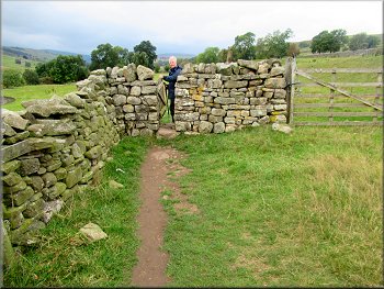There was a gated squeeze stile at each dry stone wall