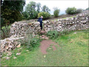 There was a gated squeeze stile at each dry stone wall