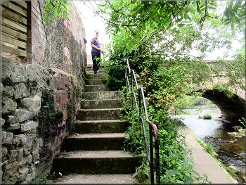 Steep stone steps from the River Skell path up to the B6265